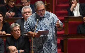 Moetai Brotherson speaks during a session of questions to the government at the National Assembly in Paris in 2019.