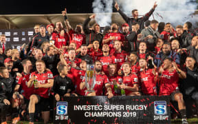 The Crusaders celebrate their win after taking out the 2019 Super Rugby title.