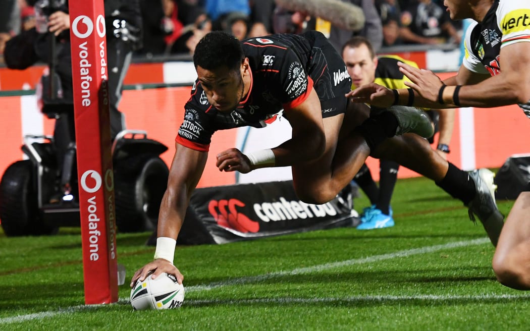 Warriors wing David Fusitu'a dives to score one of his trademark tries in the corner.