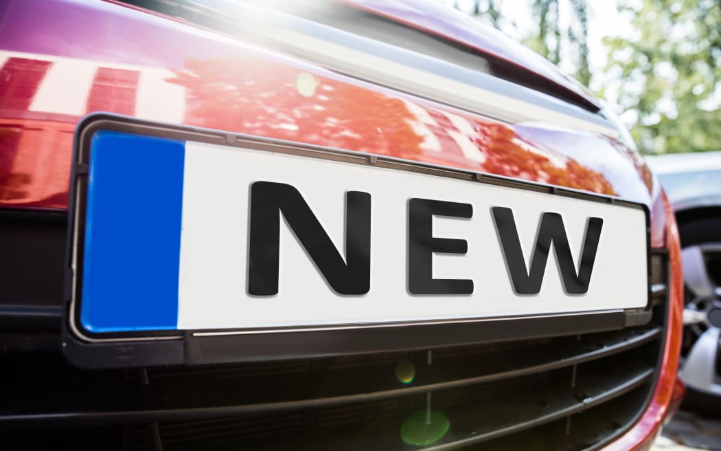 Close-up Of The License Plate Showing New Word On The Car