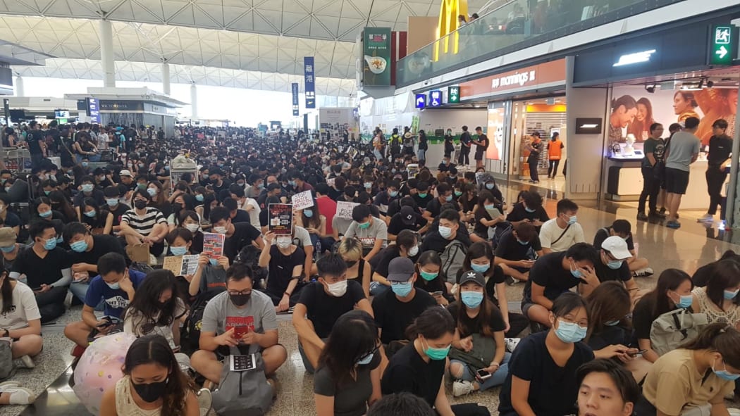 Protestors resume their sit-in at Hong Kong Airport