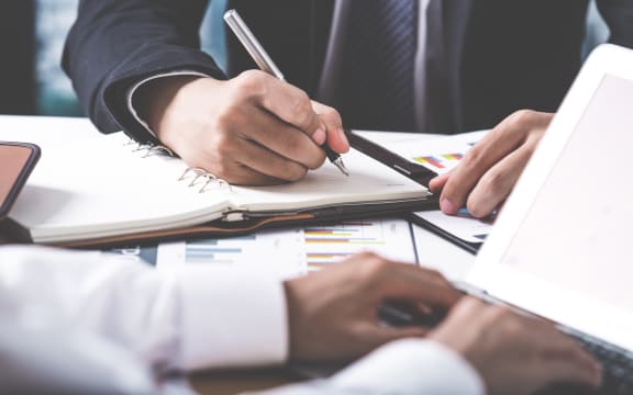 Business adviser analyzing financial figures denoting the progress in the work of the company