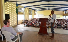 A student of KGVI asks a question to the RAMSI Special Coordinator, Quinton Devlin during the drawdown briefing at the school.