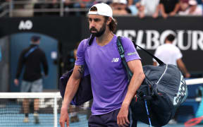 Australia’s Jordan Thompson walks off the court after his loss to Portugal’s Nuno Borges in their men’s singles match on day four of the Australian Open tennis tournament in Melbourne on January 21, 2026. (Photo by DAVID GRAY / AFP) / -- IMAGE RESTRICTED TO EDITORIAL USE - STRICTLY NO COMMERCIAL USE --