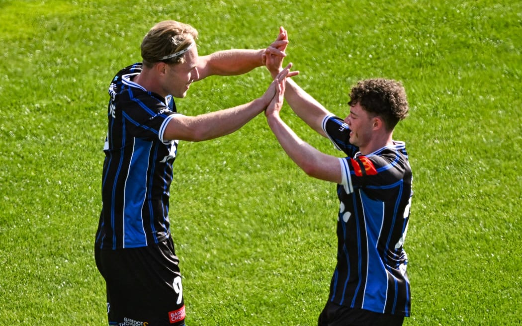 Sam Cosgrove of Auckland FC celebrates his goal with Jesse Randall.
