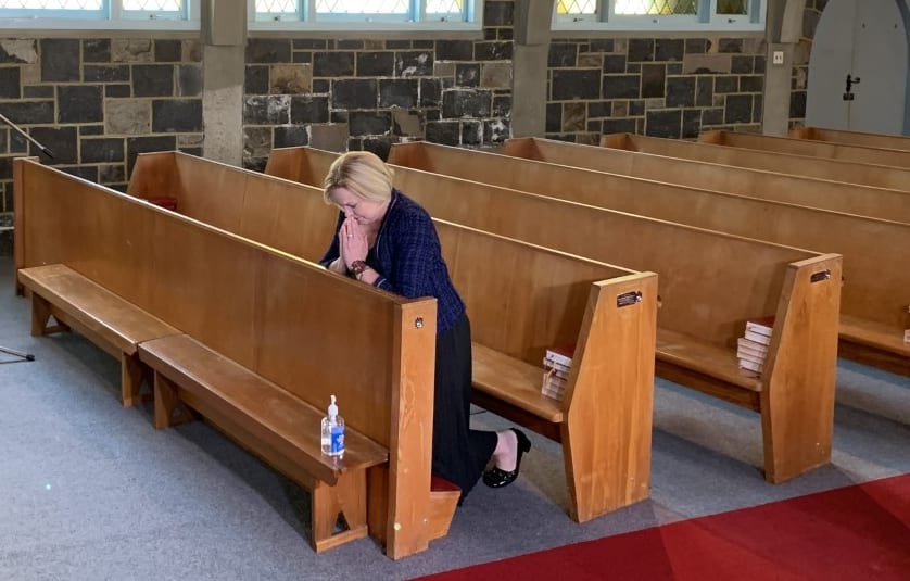 National party leader Judith Collins prays at St Thomas Church in Tāmaki before casting her early vote for the election.