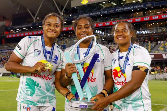 Fijiana captain Bilika Tawake, centre, holds the Super W trophy