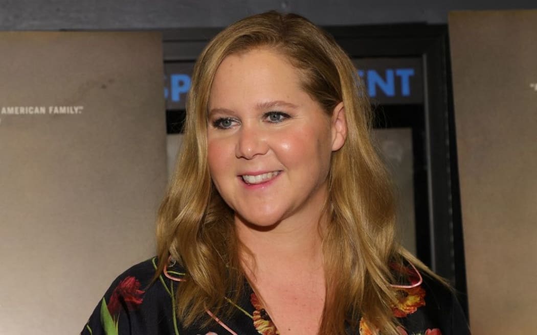 Amy Schumer attends as A24 and the Cinema Society host a screening of "The Humans" at Village East Cinema on November 18, 2021 in New York City.