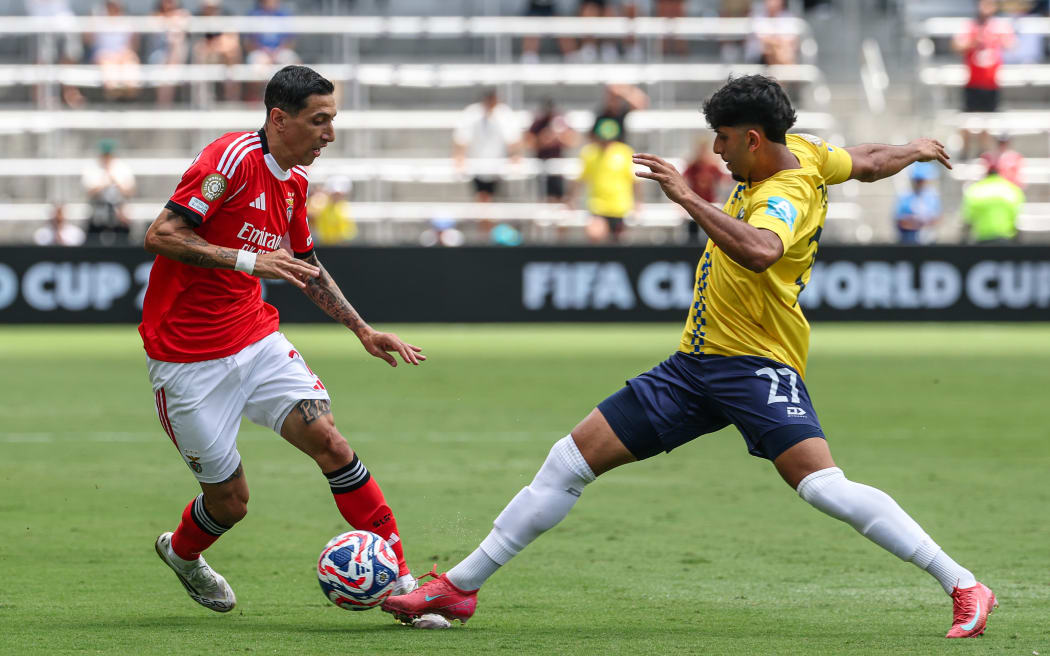 Benfica's Angel Di Maria (L) in possession against Auckland City FC.