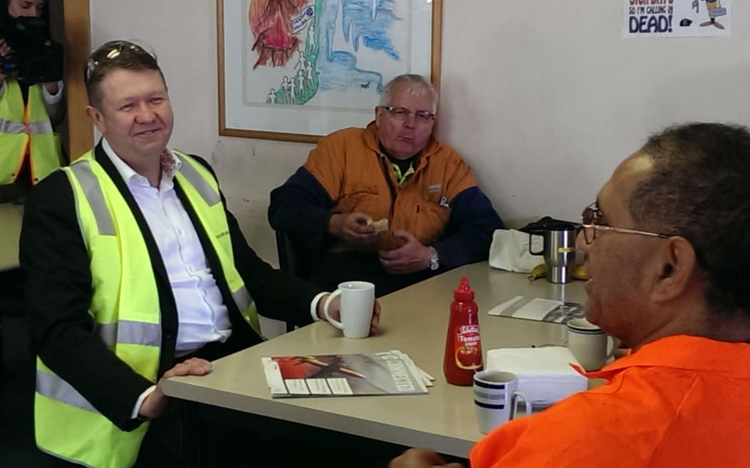 David Cunliffe (left) visiting a cable company in Auckland, on Friday.