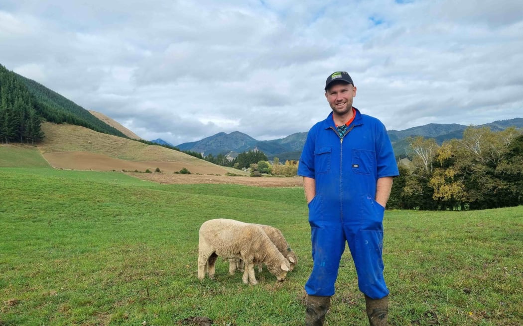 Rai Valley dairy farmer Hamish Morrison with pet lambs Summer and Winter