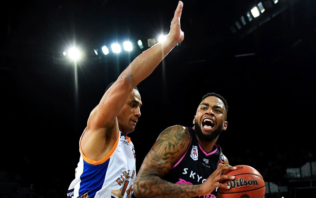 Mika Vukona guards Breakers US import Shawn Long
