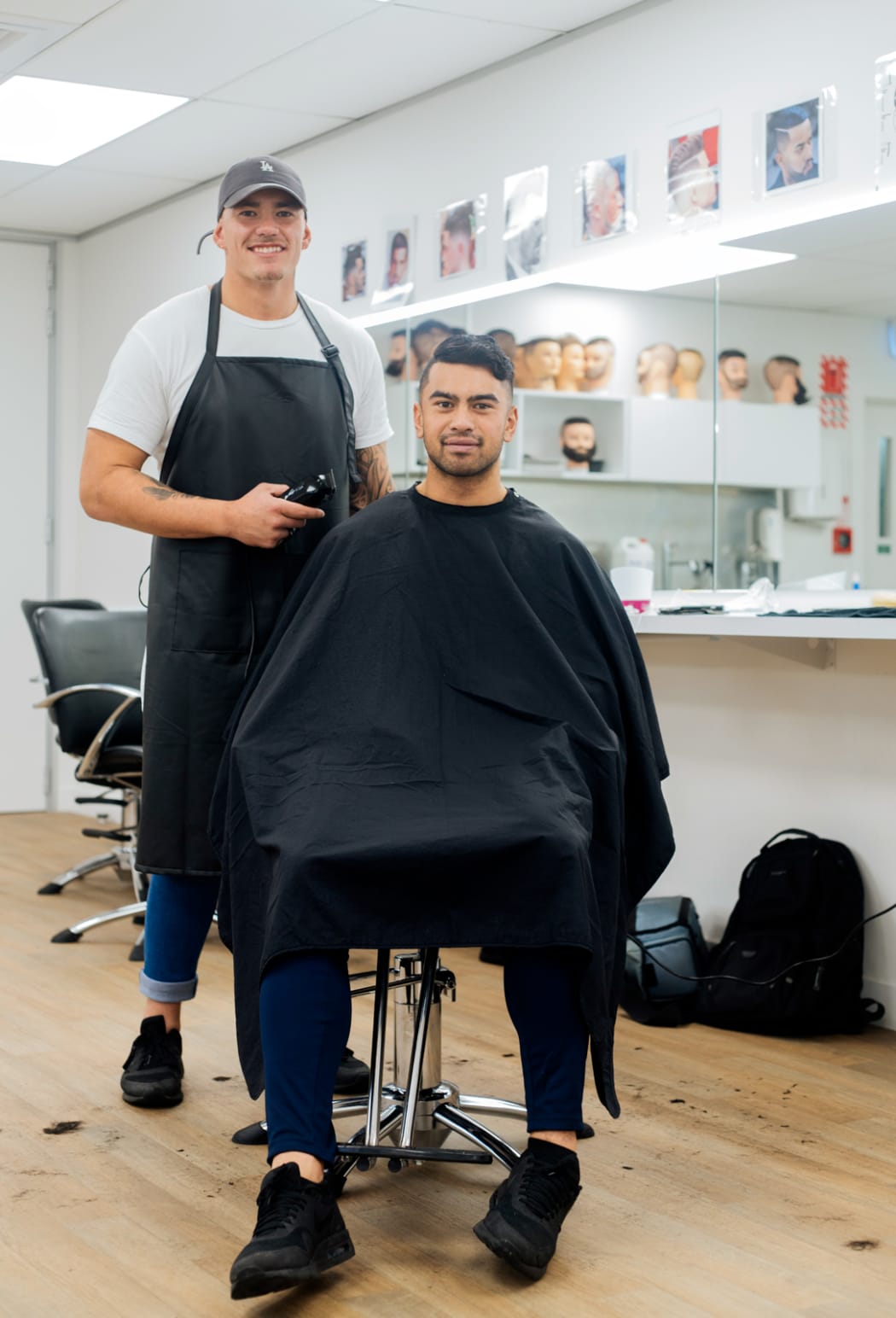 Barber Daniel Cotton with clippers in hand.