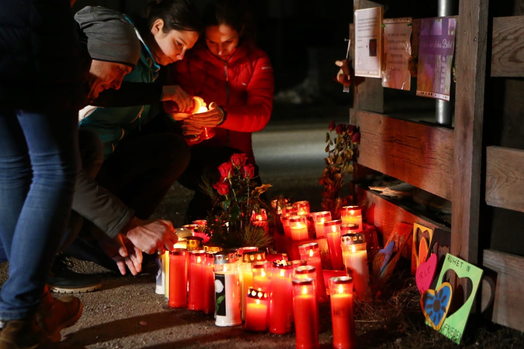 People lay candles and flowers   on Via Aurina SS 621, in Lutago, South Tyro.