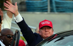 Republican Presidential candidate Donald Trump waves as leaves following a speech on board the Worl War II bettlaship USS Iowa in San Pedro, California on September 15, 2015.