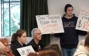 Dozens of staff and students crammed into a Massey Council meeting this week to protest proposed cuts.