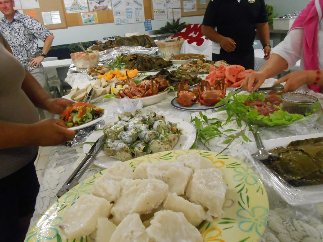 An image of a table laden with food from Niue