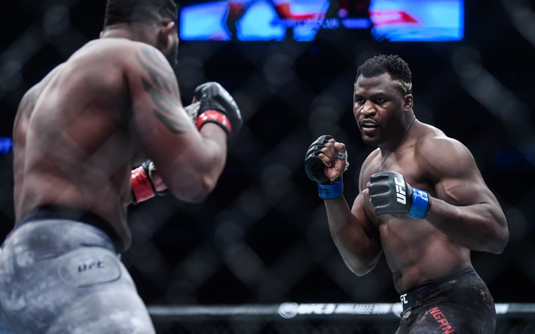 Francis Ngannou of Cameroon and France (blue gloves)  fights Curtis Blaydes of America (red gloves) during the UFC Fight Night at Cadillac Arena in Beijing, China, 24 November 2018.
