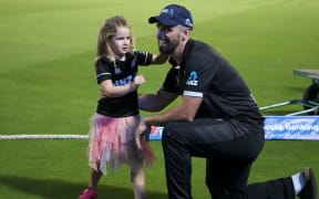 Daryl Mitchell of New Zealand with his daughter after the game against England in 2023.