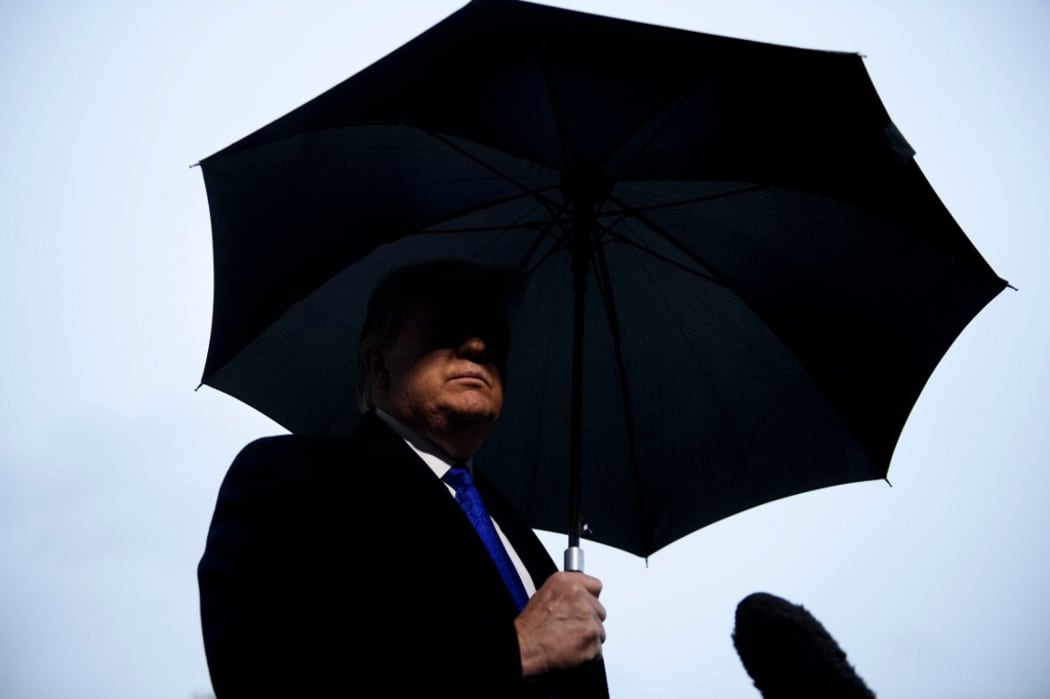 US President Donald Trump speaks to the press before departing from the White House on December 2, 2019 in Washington,DC en route to London, to meet with NATO leaders for the 70th anniversary of the alliance. (Photo by Brendan Smialowski / AFP)