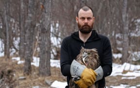 Jonathan Slaght with Blakiston's fish owl