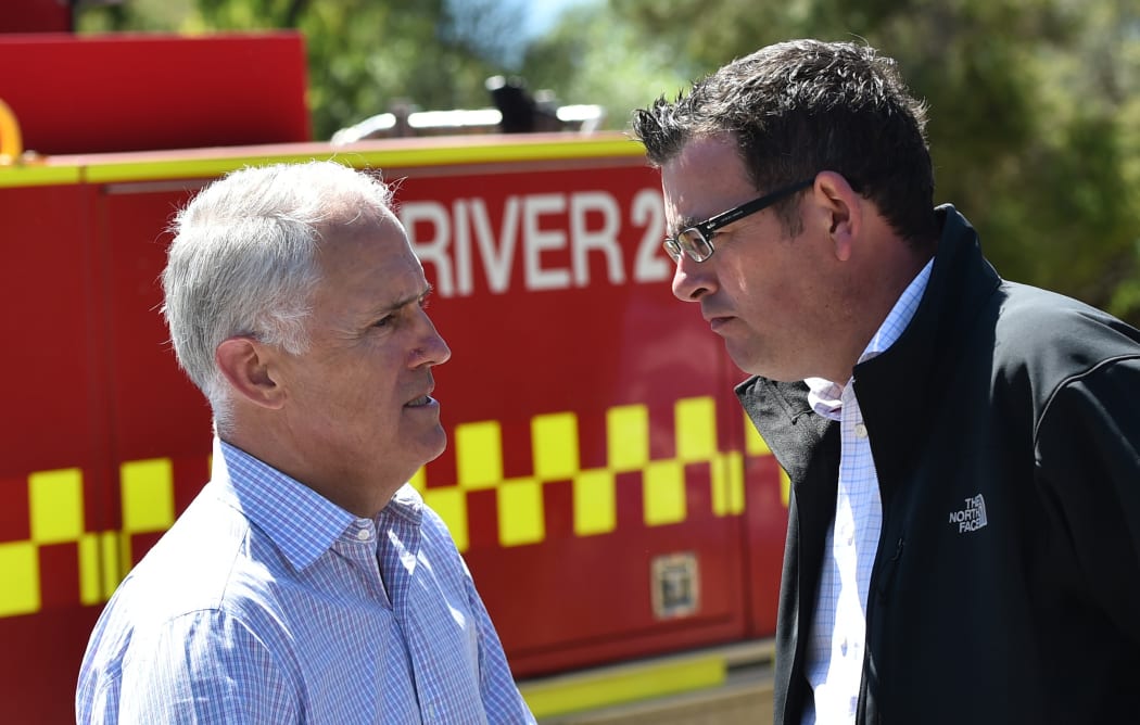 Prime Minister Malcom Turnbull (left) and Victorian Premier Daniel Andrews speak together in Wye River on Tuesday, December l29, 2015. The coastal town was razed by bushfires on Christmas Day.