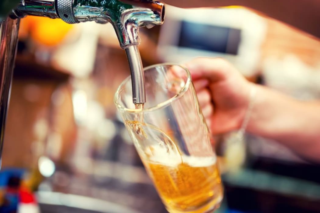 A pint of beer is poured.