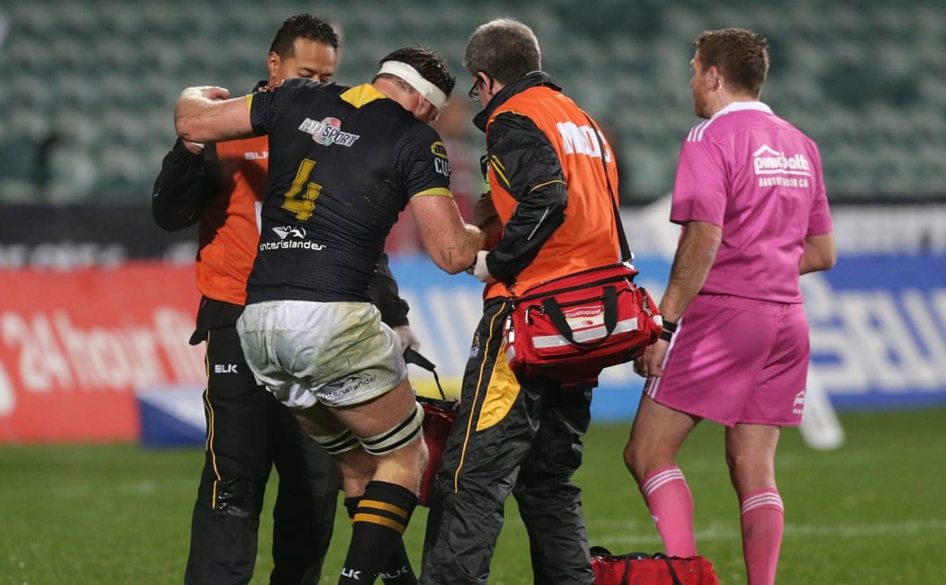 Wellington lock Jeremy Thrush helped from the field 2015.