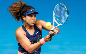 Naomi Osaka of Japan returns the ball during round 4 of the 2021 Australian Open on February 14 2020, at Melbourne Park in Melbourne, Australia.