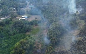 Aitutaki’s Crash Fire firefighters reacted swiftly and carried out a back-burn near homes, clearing approximately 20 metres of dry fuel uphill from the residential area. ALAN NANAI/25111051