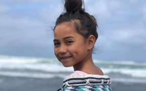 Child wearing korowai