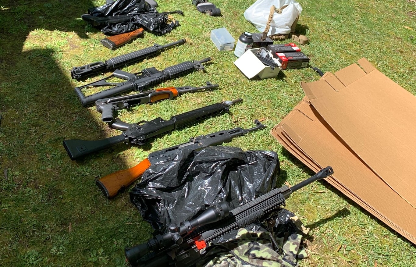 Dozens of firearms including a large number of prohibited military style semi-automatic firearms, a shotgun and a pistol were found in a search warrant.