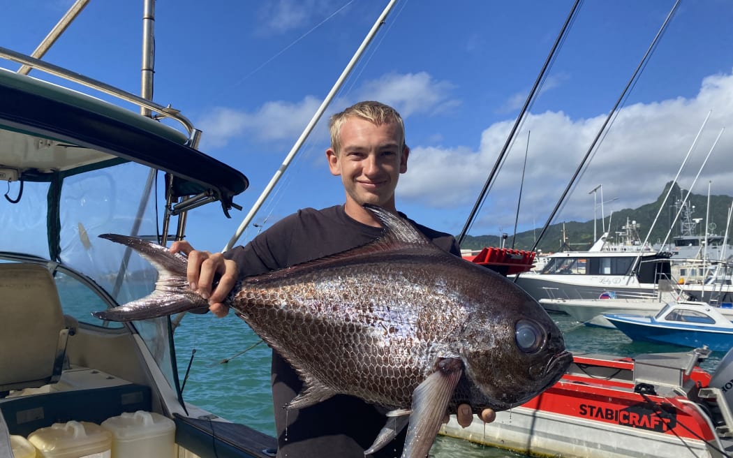 Troy Henderson with his catch of the day in Avarua, Rarotonga.