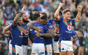 The Warriors celebrate their golden point win over the Raiders.