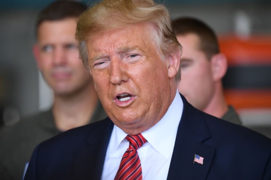 US President Donald Trump speaks during a storm briefing with the US Coast Guard, after disembarking from Air Force One upon arrival at Ellington Field Joint Reserve Base in Houston, Texas, September 22, 2019.