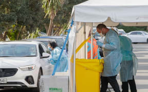 Testing being conducted by health workers at a COVID-19 testing station setup at Eden Park, National Sports Stadium, in Auckland on August 14, 2020.
