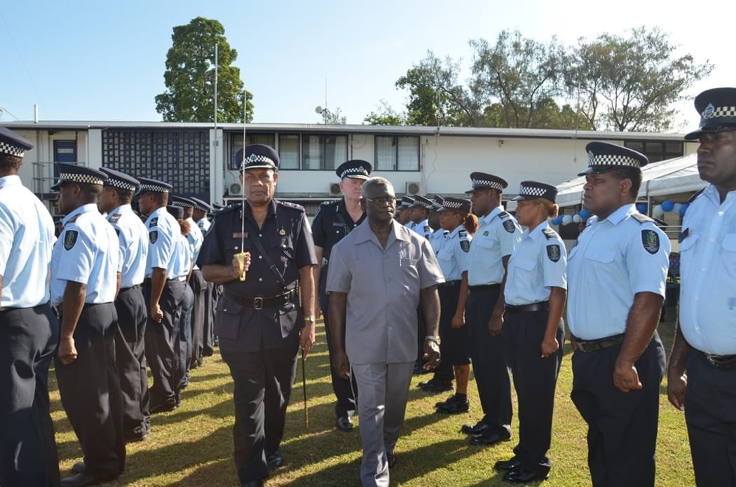 Solomon Islands Prime Minister Manasseh Sogavare inspects a guard of honour by members of the RSIPF before the opening of the National Response Department facility.