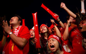 Myanmar opposition supporters celebreate outside the National League of Democracy (NLD) headquarters in Yangon.