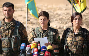 Jihan Sheikh Ahmed, a spokeswoman for the Syrian Democratic Forces (SDF), holds a news conference in the town of Ain Issa, some 50km north of Raqqa on 6 November 2016.