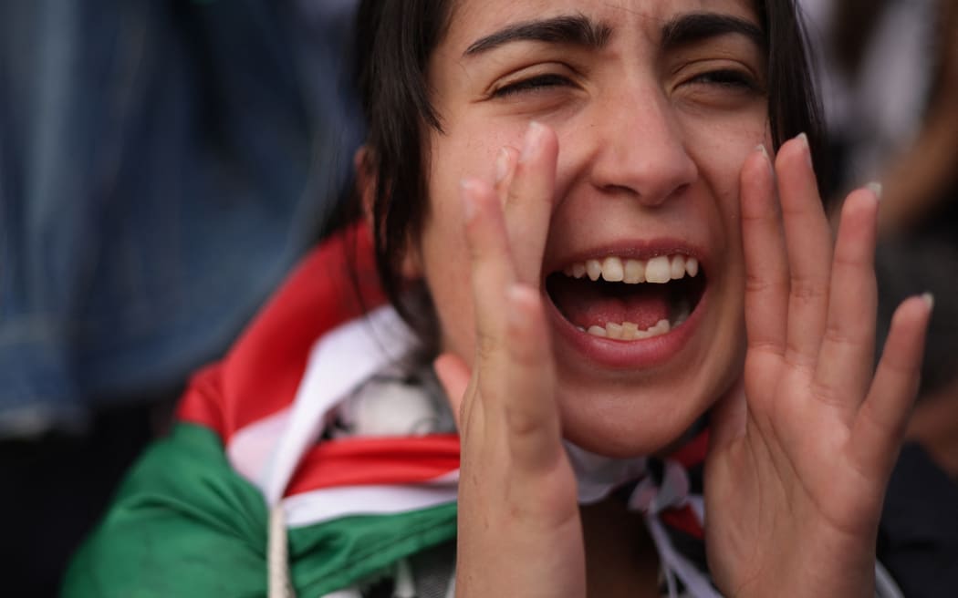 A protester shouts slogans during the "National March on Washington: Free Palestine" at the Freedom Plaza while calling for a ceasefire between Israel and Hamas on 4 November.