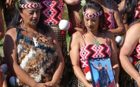 Te Waka Huia members holding a photo of Dr Ngapo Wehi.