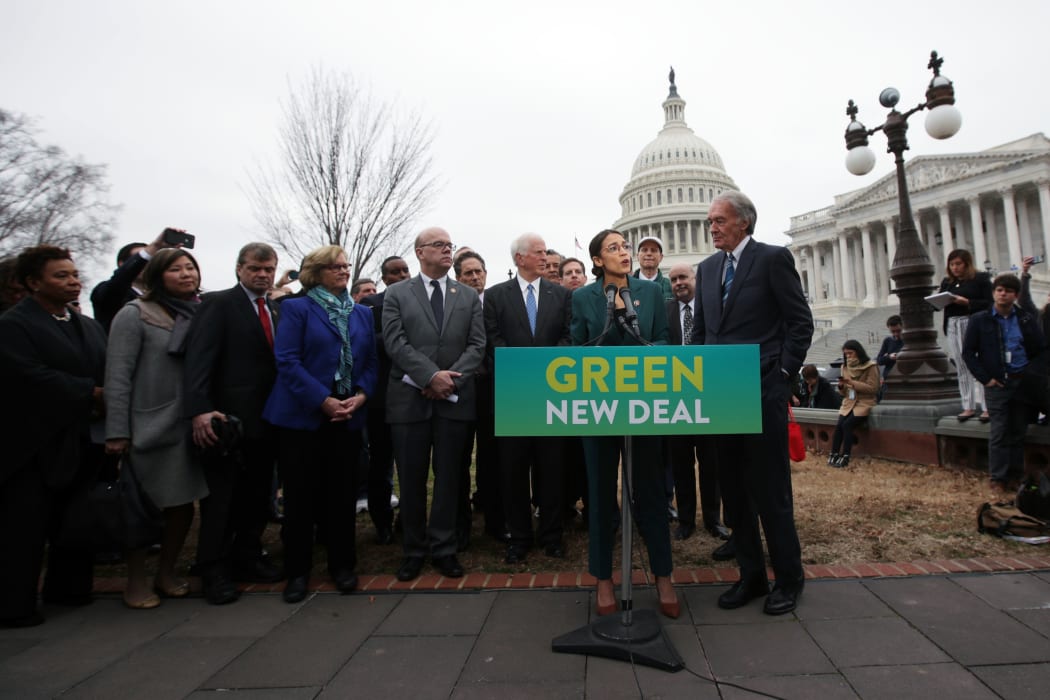 Representative Alexandria Ocasio-Cortez, Senator Ed Markey and other Congressional Democrats unveil their Green New Deal resolution in front of the US Capitol.