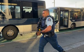 A police officer responds to a serious incident in Auckland CBD on 20 July, 2023.