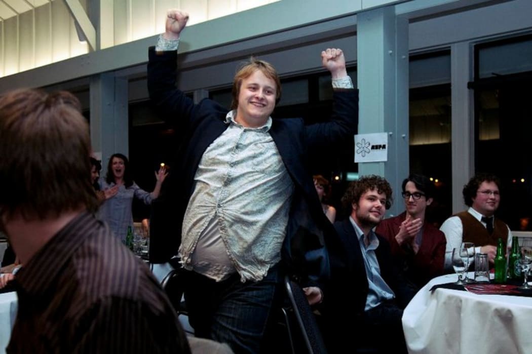 Uther Dean pictured winning Best Reviewer Award at the Aotearoa Student Press Association Awards in 2010