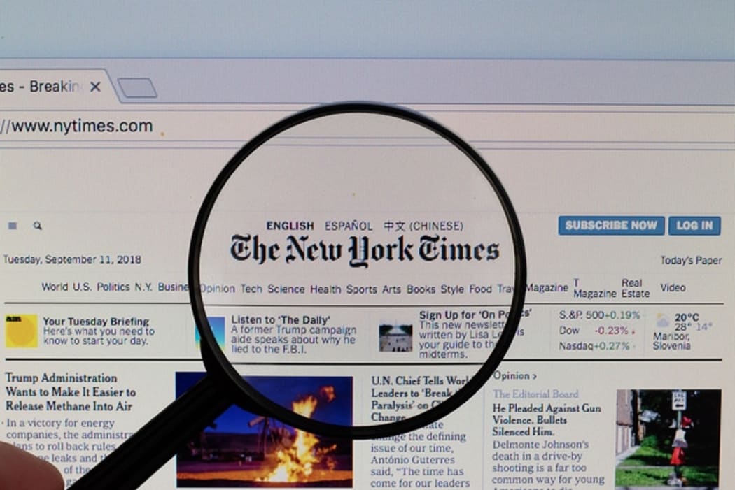 The New York Times logo on a computer screen with a magnifying glass (Flickr user Marco Verch CC BY 2.0)