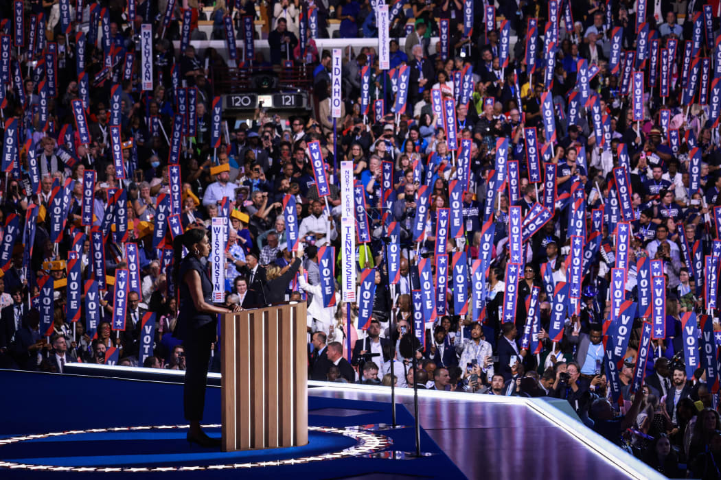 CHICAGO, ILLINOIS - AUGUST 20: Former first lady Michelle Obama speaks on stage during the second day of the Democratic National Convention at the United Center on August 20, 2024 in Chicago, Illinois. Delegates, politicians, and Democratic Party supporters are gathering in Chicago, as current Vice President Kamala Harris is named her party's presidential nominee. The DNC takes place from August 19-22.   Joe Raedle/Getty Images/AFP (Photo by JOE RAEDLE / GETTY IMAGES NORTH AMERICA / Getty Images via AFP)