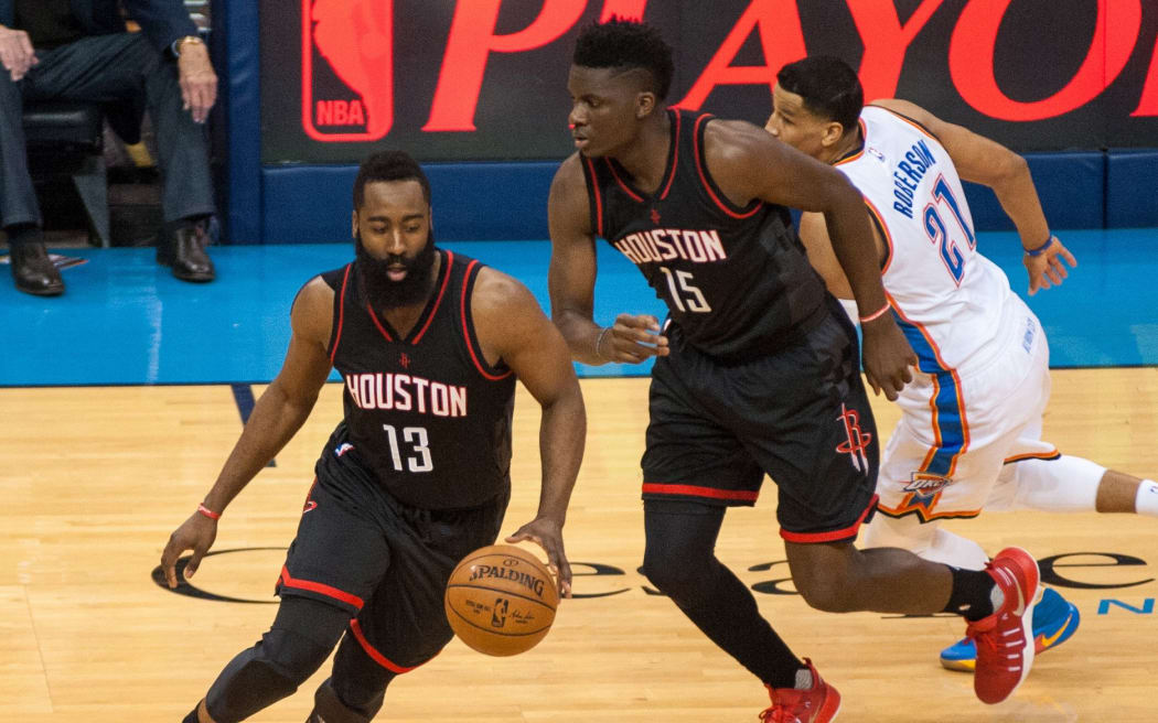 Houston Rockets guard James Harden (13) and center Clint Capela.