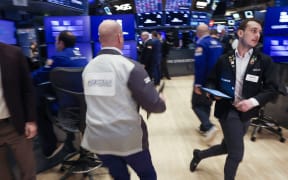Traders work on the floor of the New York Stock Exchange in New York City, on April 7, 2025. Wall Street stocks opened sharply lower Monday, joining a global selloff on worries that a trade war induced by US President Donald Trump's tariffs will spark a global economic slowdown. (Photo by TIMOTHY A. CLARY / AFP)
