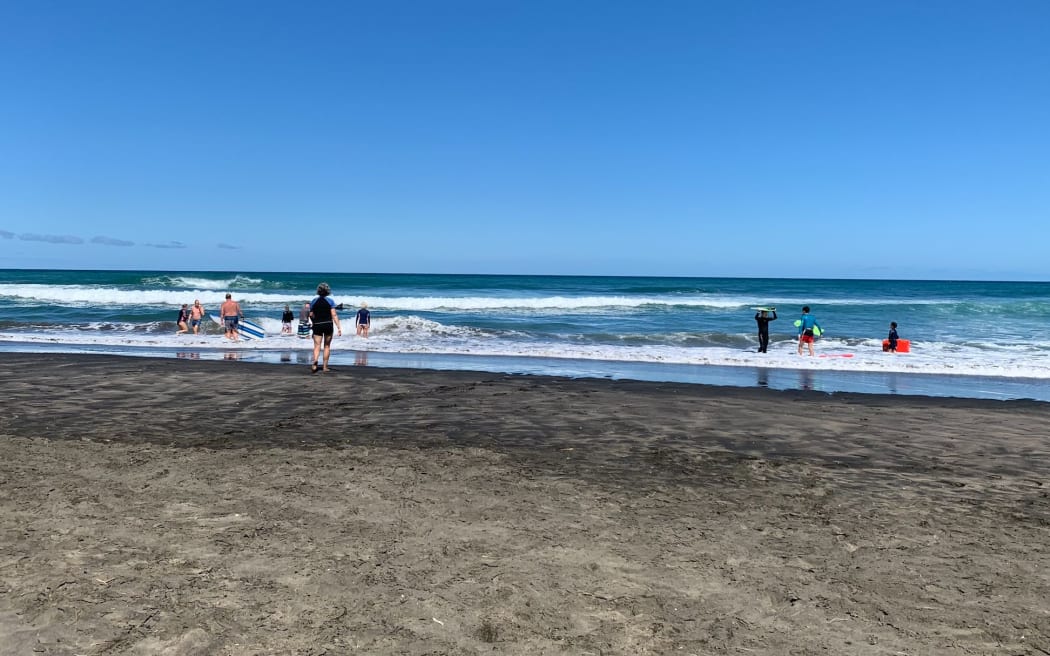 Surf lifesavers at Piha Beach