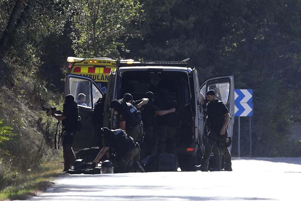 Bomb squad police at the site where Moroccan suspect Younes Abouyaaqoub was shot on 21 August 2017.